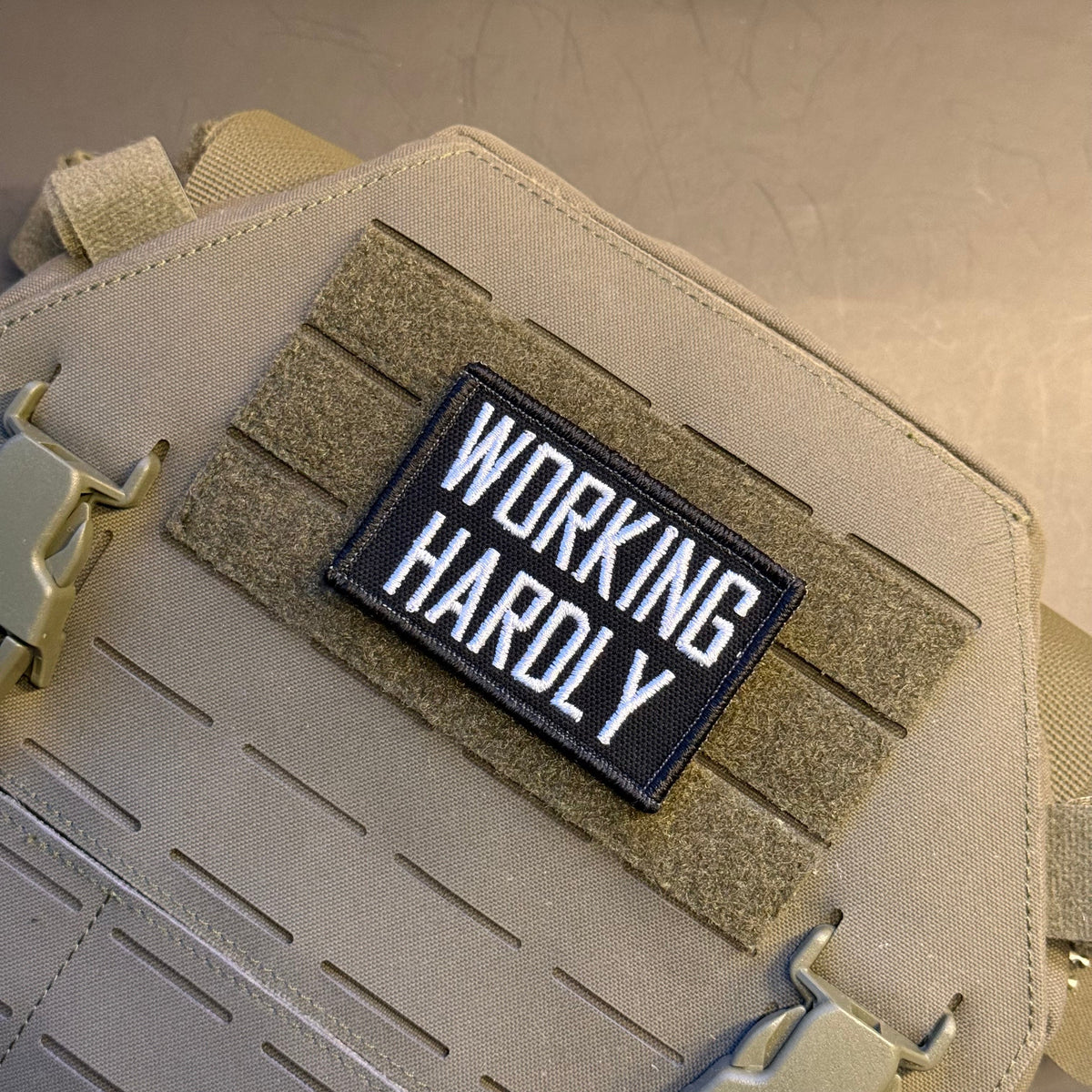 Working Hardly Funny Morale Patch, 2x3" | Made in USA | VELCRO® Brand Hook Backing