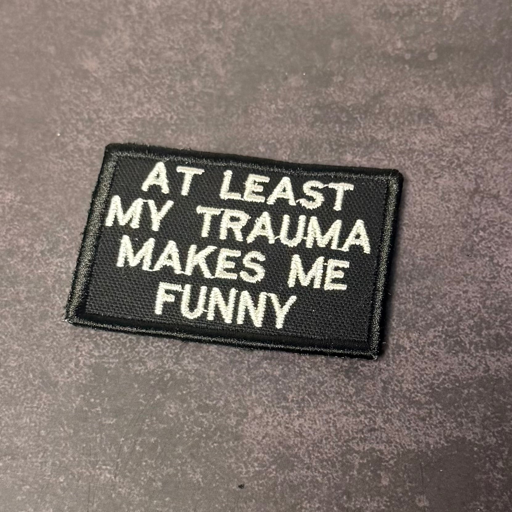 At Least My Trauma Makes Me Funny Morale Patch, 2x3" | Made in USA | VELCRO® Brand Hook Backing