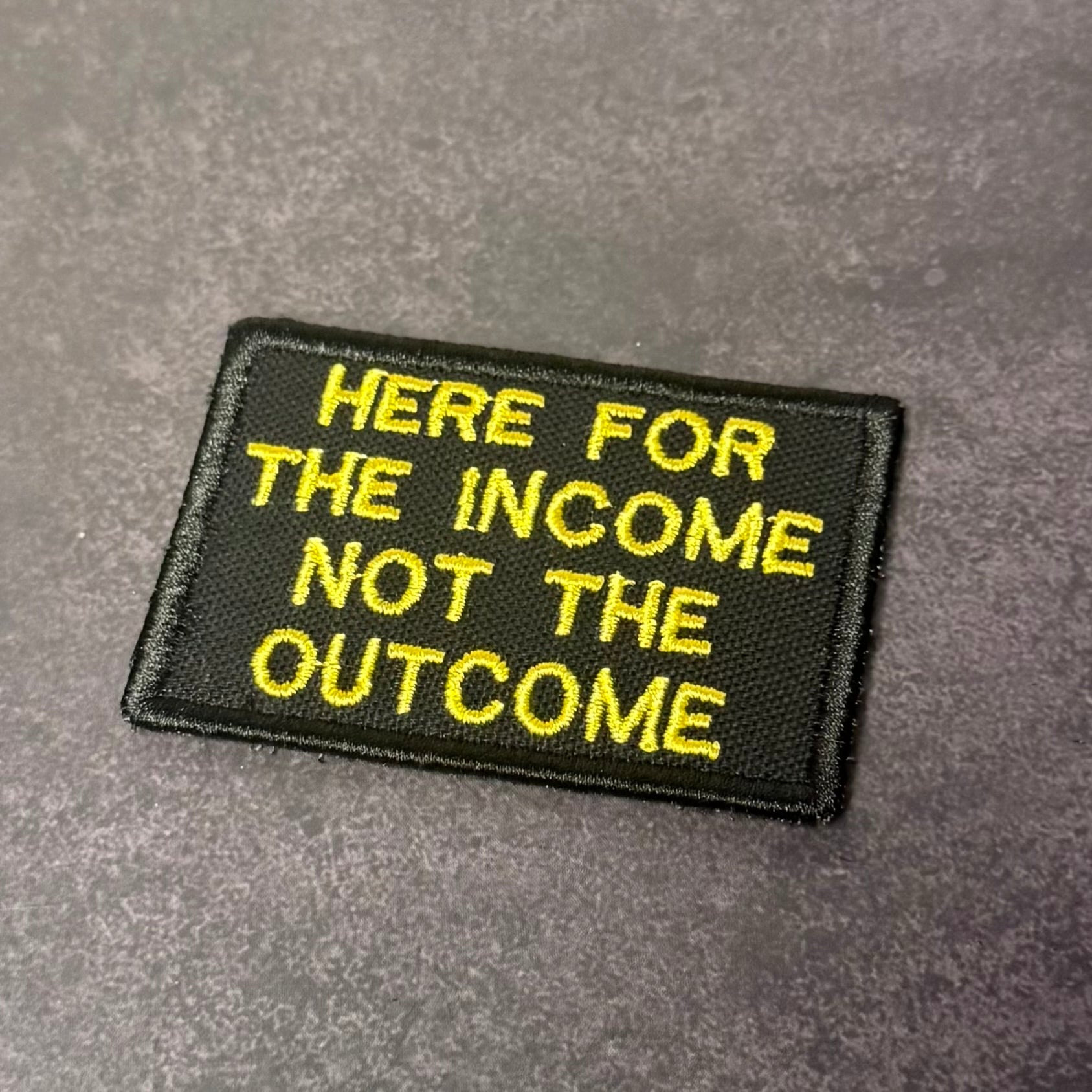 Here For The Income, Not The Outcome Funny Morale Patch, 2x3" | Made in USA | VELCRO® Brand Hook Backing