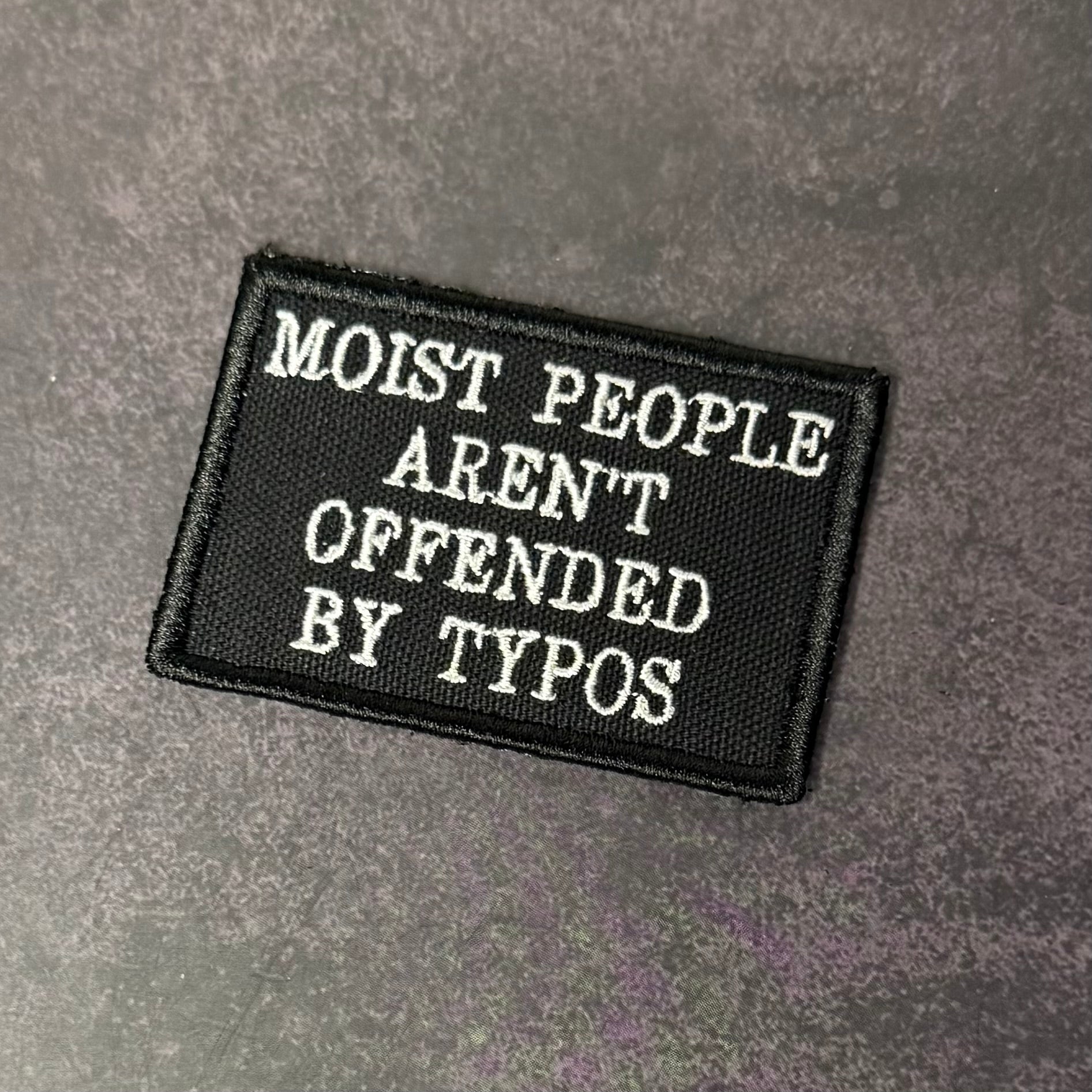Moist People Aren’t Offended by Typos Funny Morale Patch | Made in USA | VELCRO® Brand Hook Backing