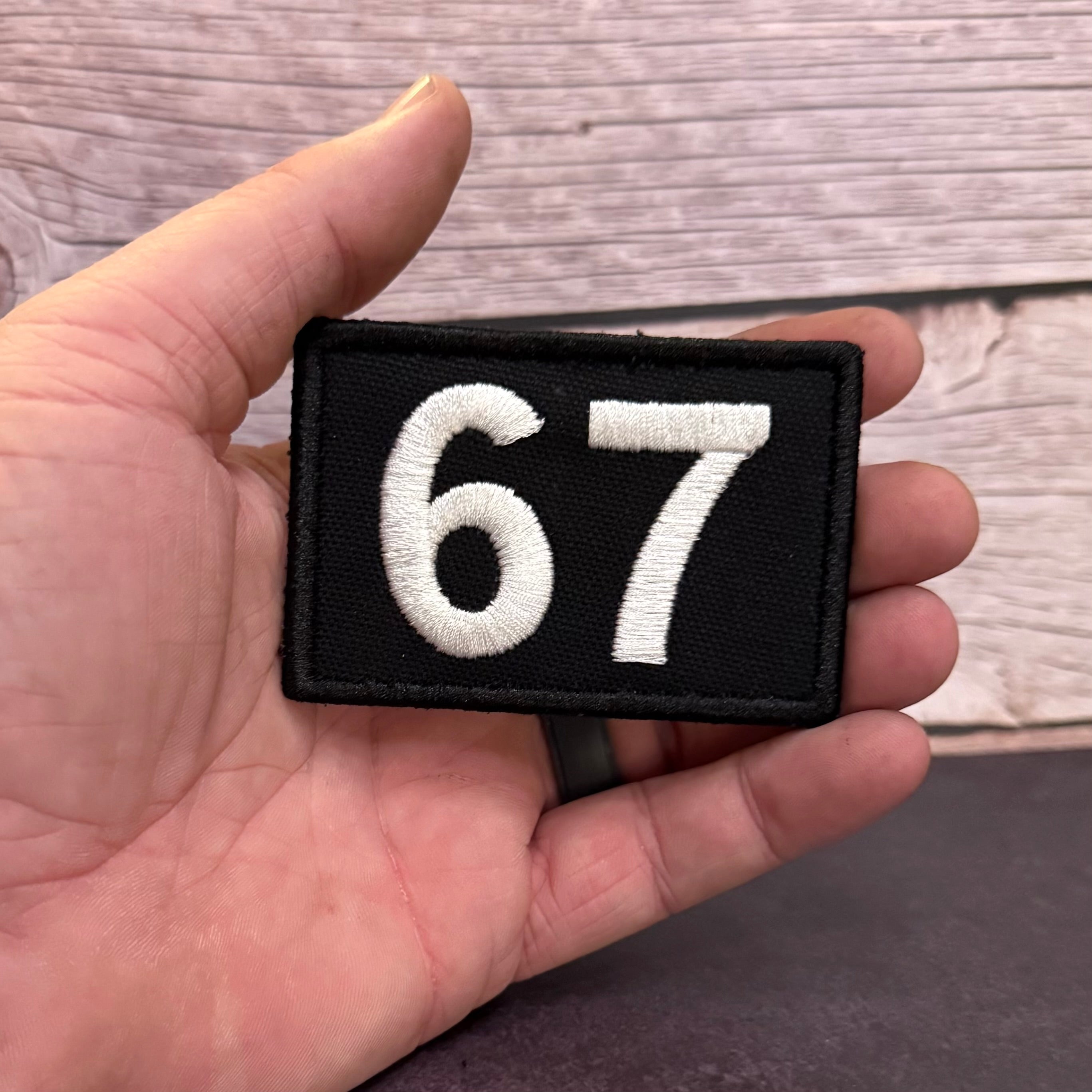 67 -Six Seven- Funny Morale Patch, 2x3" | Made in USA | VELCRO® Brand Hook Backing