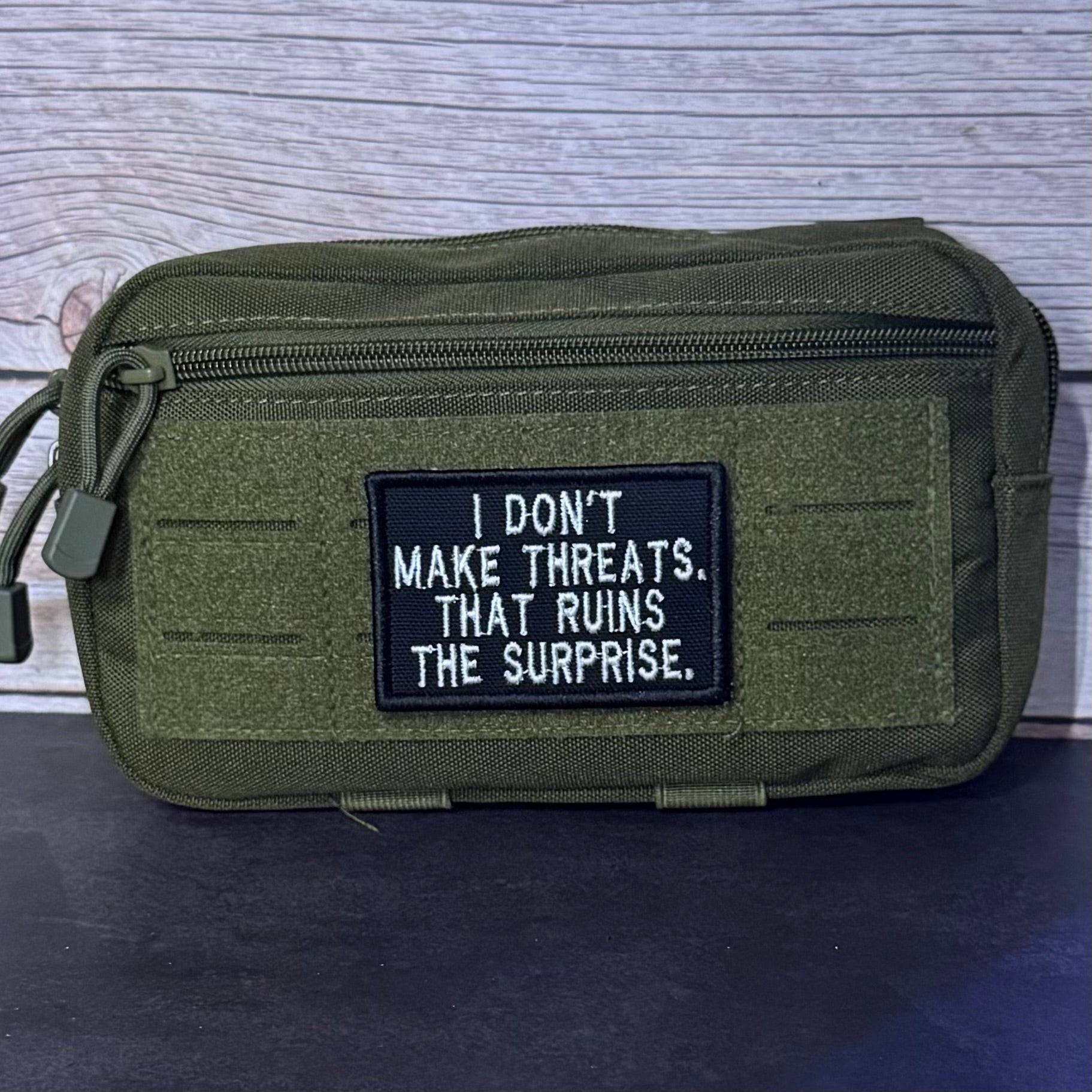 I Don't Make Threats, That Ruins The Surprise Funny Morale Patch, 2x3" | Made in USA | VELCRO® Brand Hook Backing