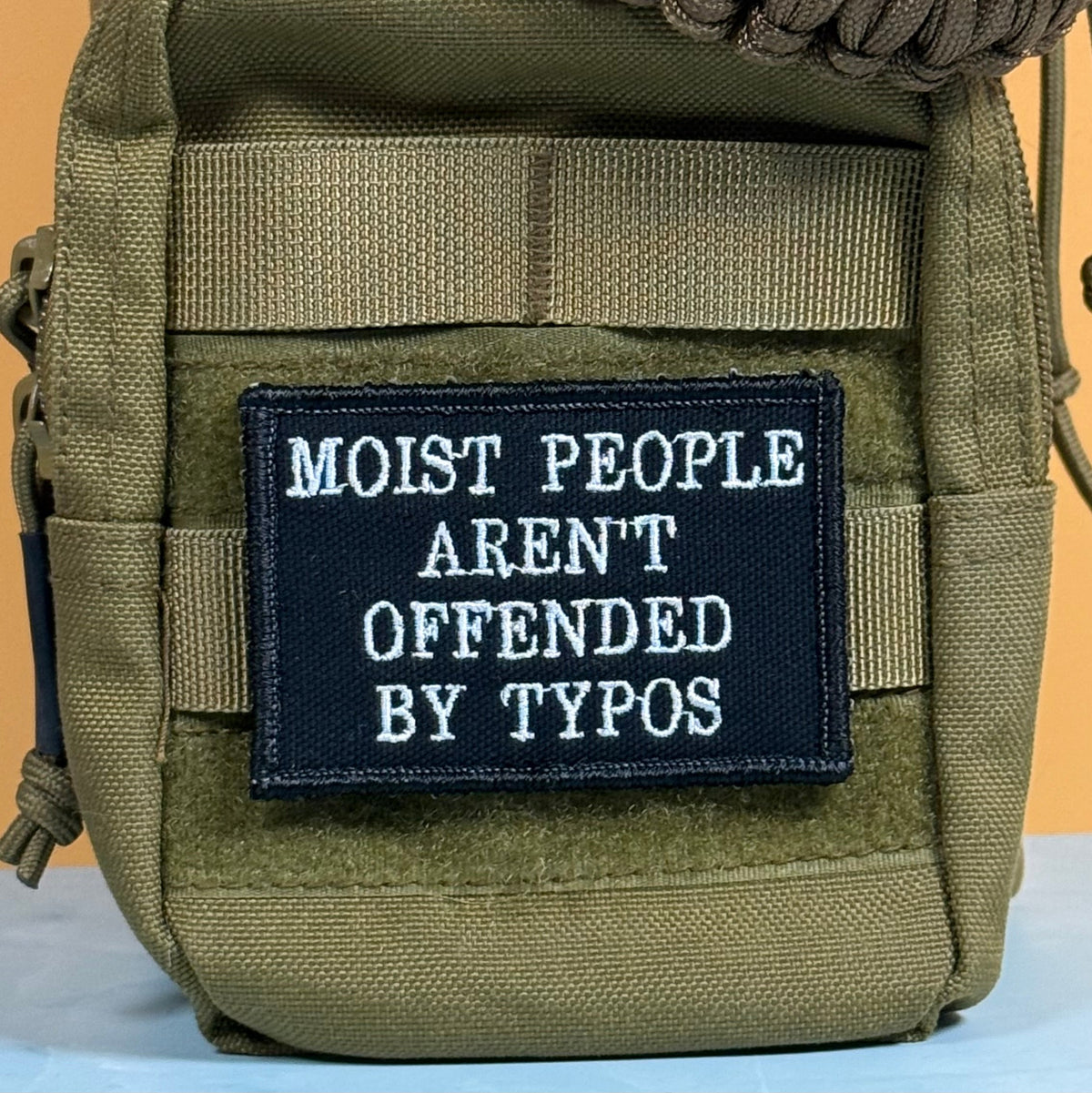 Moist People Aren’t Offended by Typos Funny Morale Patch | Made in USA | VELCRO® Brand Hook Backing