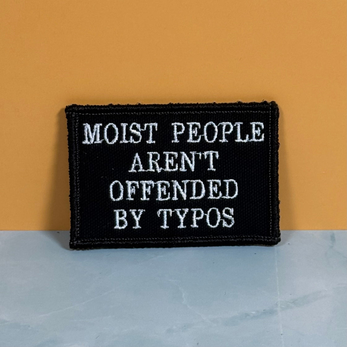 Moist People Aren’t Offended by Typos Funny Morale Patch | Made in USA | VELCRO® Brand Hook Backing