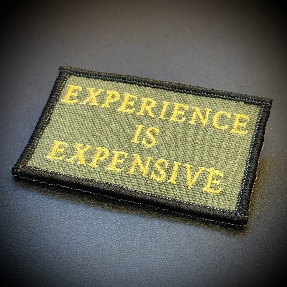 Experience Is Expensive Funny Tactical Morale Patch, 2x3" | Made in USA | VELCRO® Brand Hook Backing