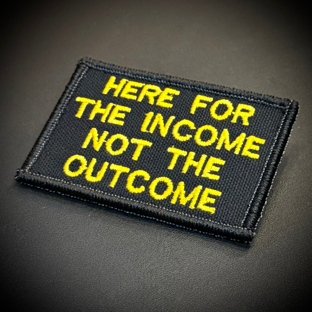 Here For The Income, Not The Outcome Funny Morale Patch, 2x3" | Made in USA | VELCRO® Brand Hook Backing