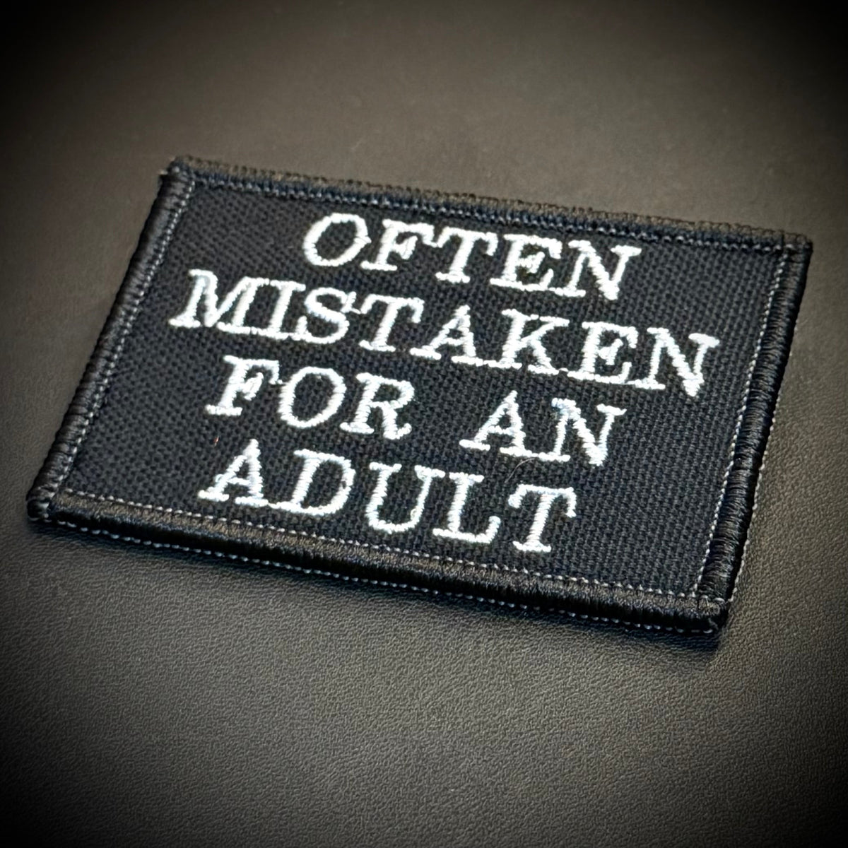 Often Mistaken For An Adult Funny Morale Patch, 2x3" | Made in USA | VELCRO® Brand Hook Backing