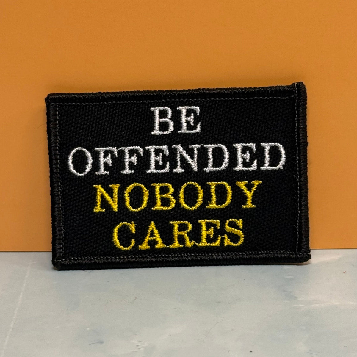 Be Offended, Nobody Cares Funny Morale Patch, 2x3" | Made in USA | VELCRO® Brand Hook Backing