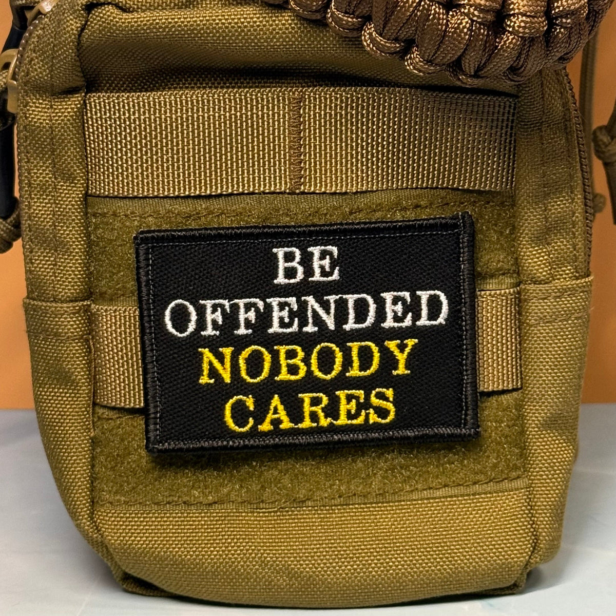 Be Offended, Nobody Cares Funny Morale Patch, 2x3" | Made in USA | VELCRO® Brand Hook Backing