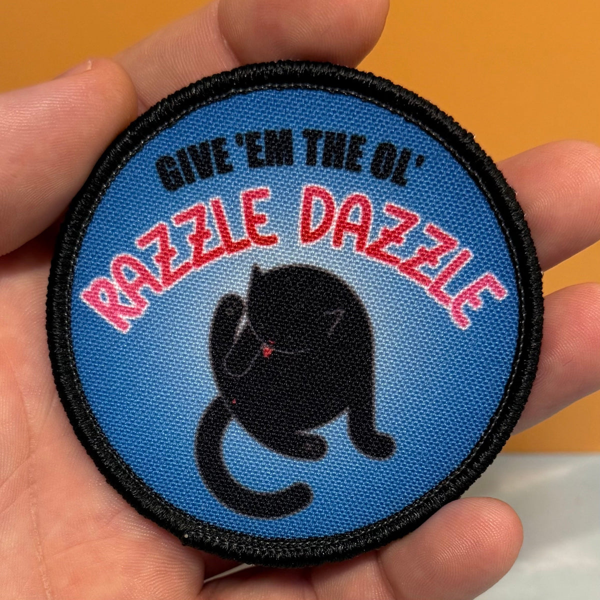 Give 'Em The Razzle Dazzle Funny Morale Patch | Made in USA | VELCRO® Brand Hook Backing