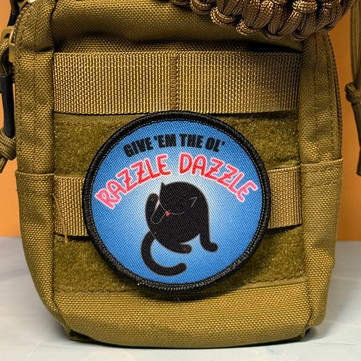 Give 'Em The Razzle Dazzle Funny Morale Patch | Made in USA | VELCRO® Brand Hook Backing