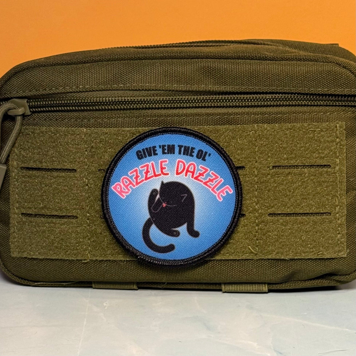 Give 'Em The Razzle Dazzle Funny Morale Patch | Made in USA | VELCRO® Brand Hook Backing