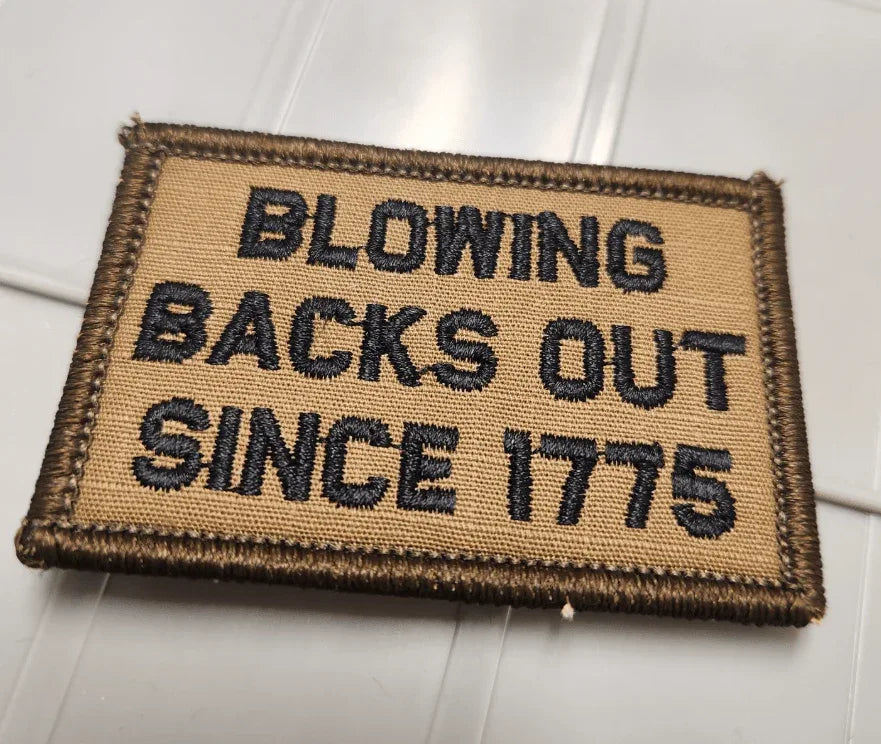 As Seen on Socials - Blowing Backs Out Since 1775 - 2x3 Patch - Coyote w/Black