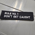 As Seen on Socials - Rule No. 1 - Don't Get Caught - 1x3.75 Patch - Black w/White